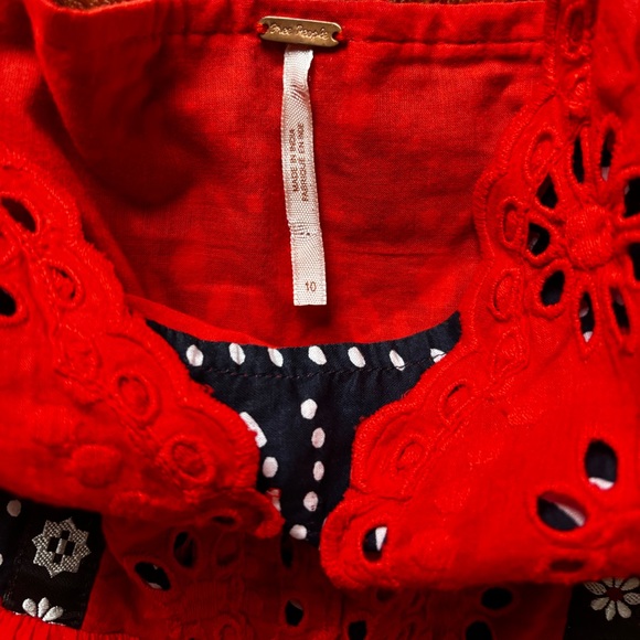 This image features the Free People Bossa Nova Eyelet High Low Dress - Picture 9 of 13